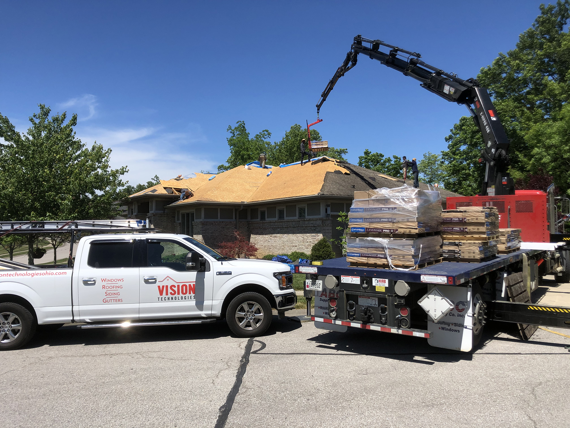 Vision Technologies truck at a roof repair worksite